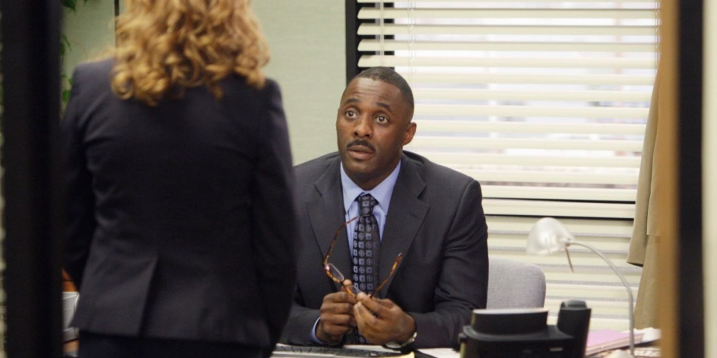 Charles Miner (Idris Elba) sat at his desk in The Office season 5