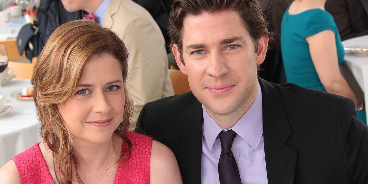 Jim and Pam smiling at the camera in The Office