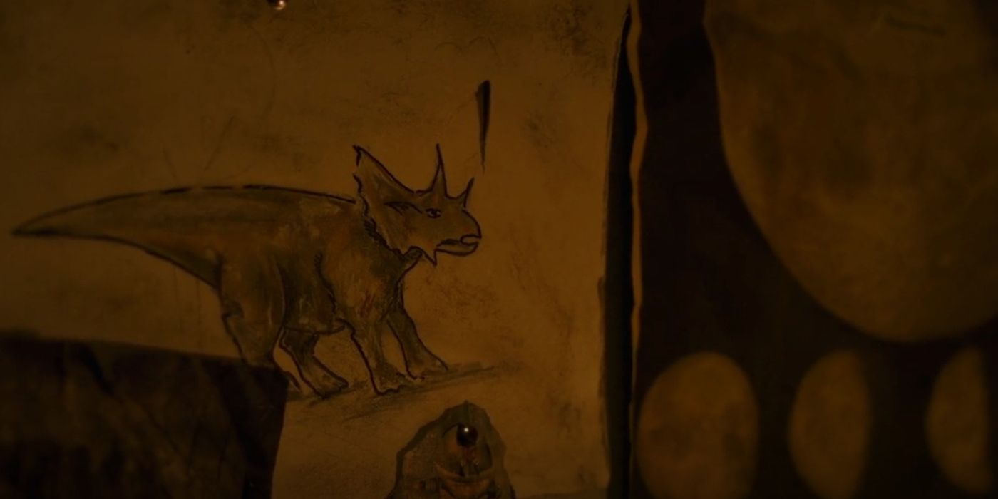 A cartoon Triceratops and a moon chart posted on Ellie's wall in The Last of Us Episode 7