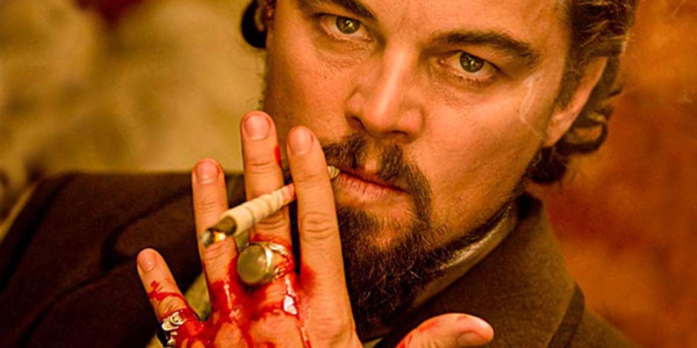 Candie smokes a cigarette while his hand bleeds in Django Unchained 