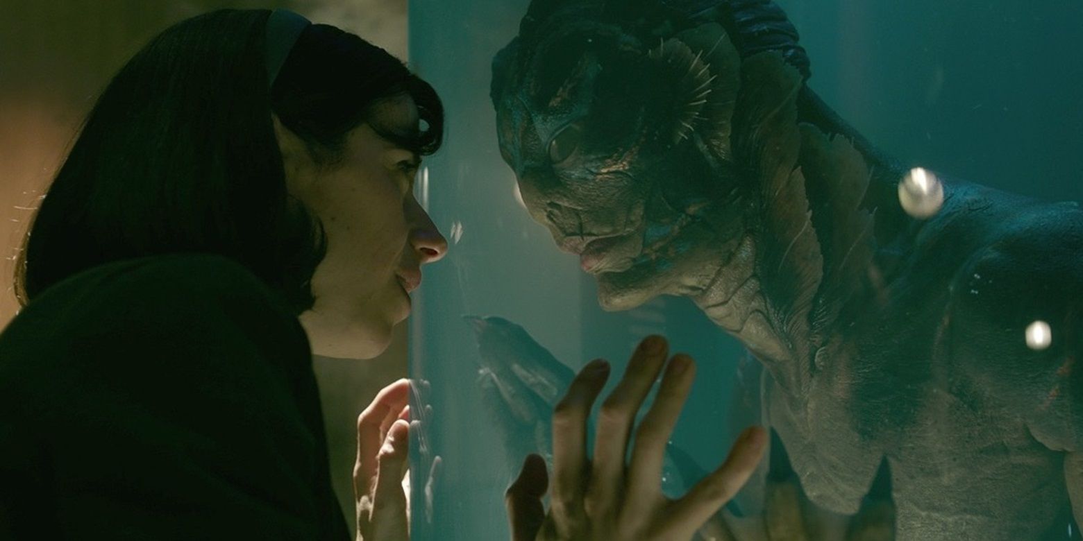 Elisa (Sally Hawkins) and the amphibian man (Doug Jones) look at each other in The Shape of Water