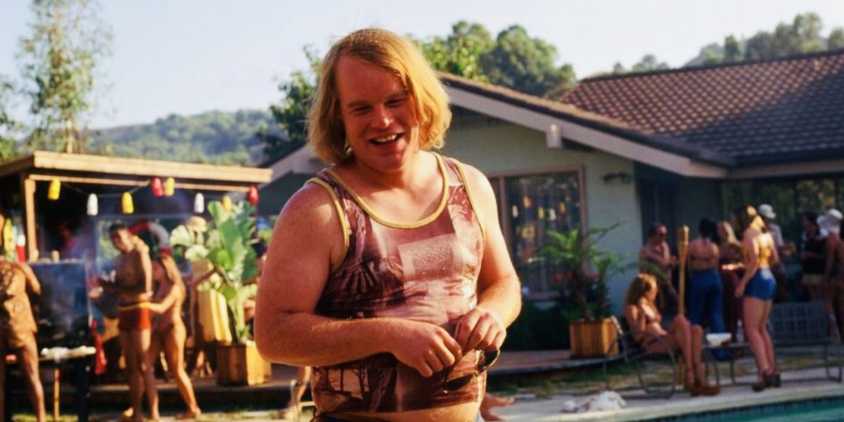 Philip Seymour Hoffman laughing as Scotty in Boogie Nights