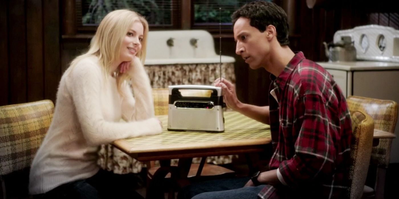 An image of Britta and Abed sitting at a table in Community