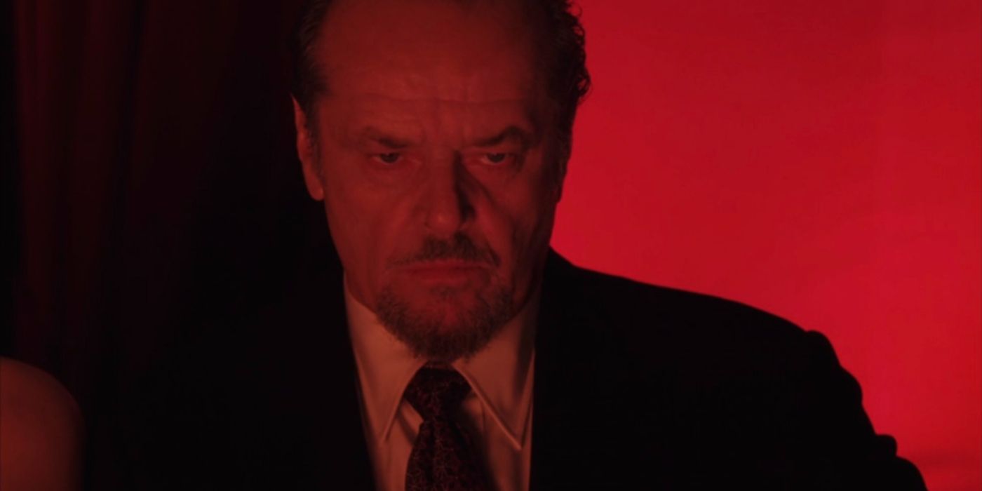 Frank in red lighting in The Departed