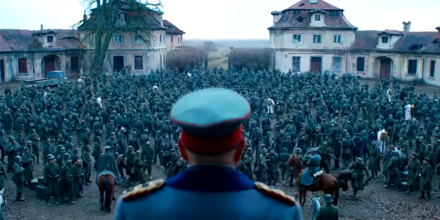 German troops heading to the front after General Friedrichs, pictured from behind, gives his speech about never surrendering. 