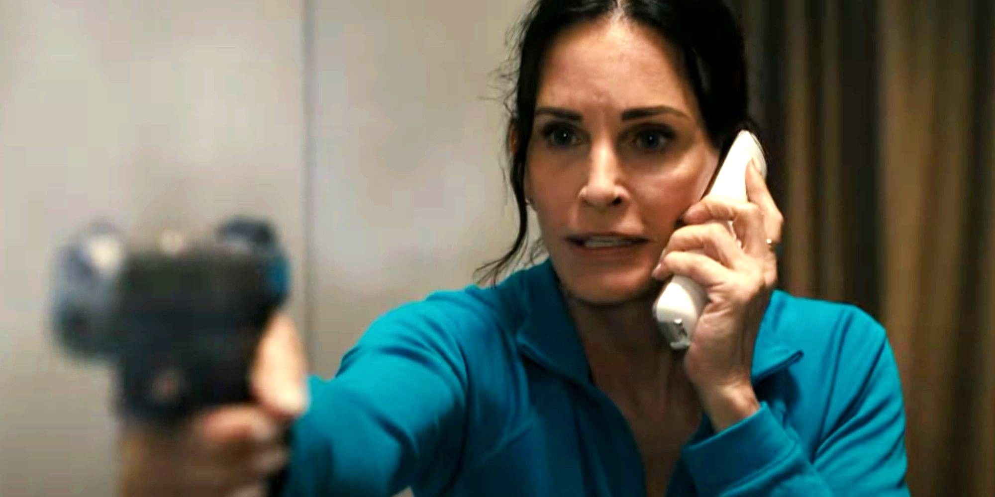 Gale points her gun up while speaking to Ghostface in Scream 6