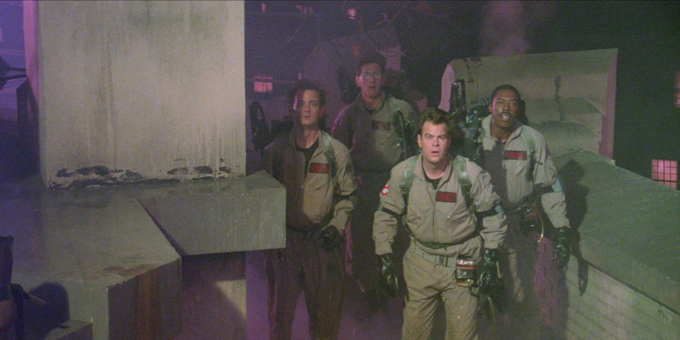 Ghostbusters standing together as things explode