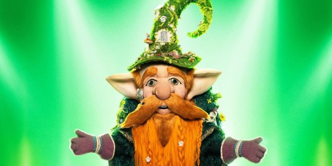 Gnome The Masked Singer posing in front of green background