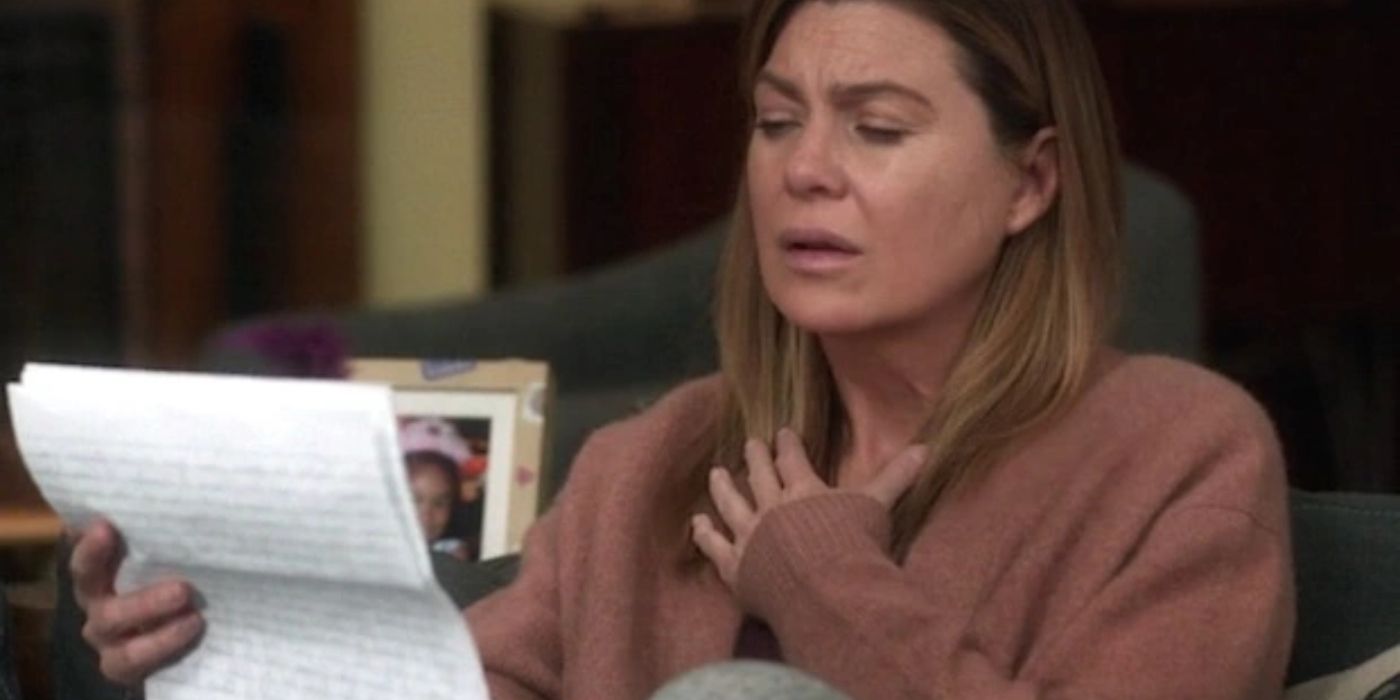 Meredith holding her chest and reading a letter on Grey's Anatomy