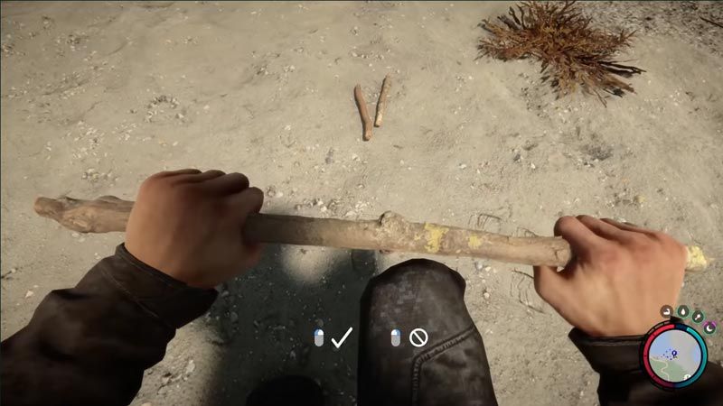 The player breaks a stick on the beach in Sons of the Forest