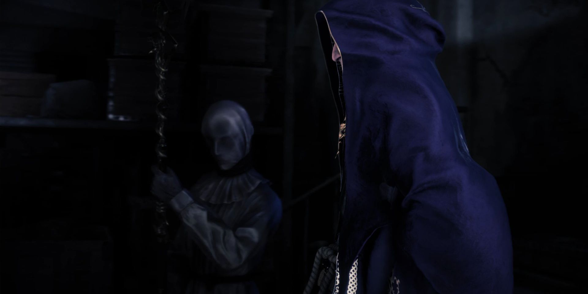 In footage from Resident Evil 4 Remake, a dark-robed Zealot stands in the foreground with what appears to be a cloth-hooded female Zealot behind