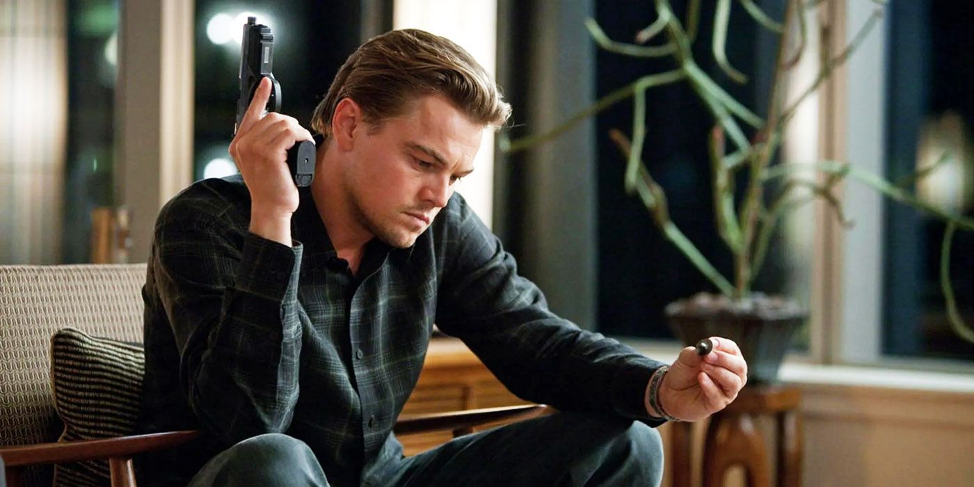 Dom Cobb holding a gun in Inception