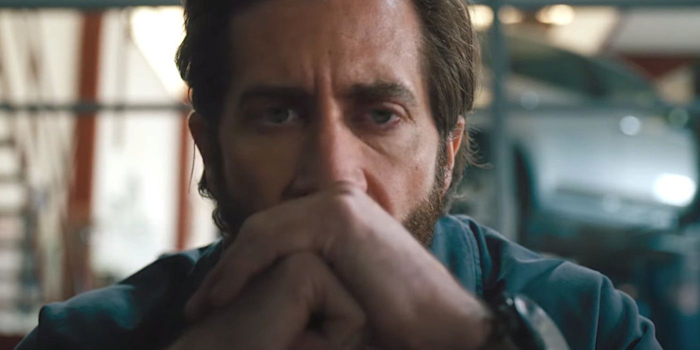 Jake Gyllenhaal in The Covenant holding his hands clasped in front of his face while gazing ahead intently