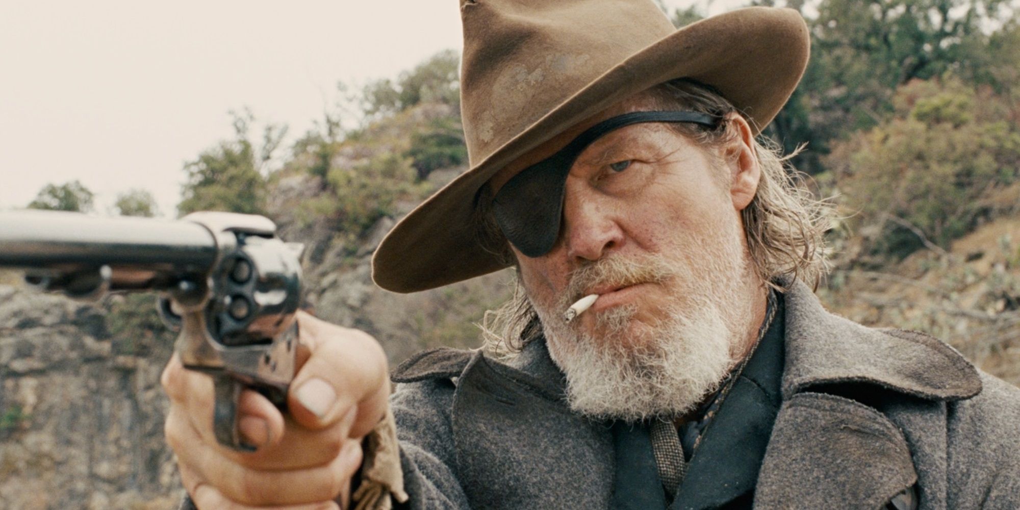 Jeff Bridges with a pistol in True Grit