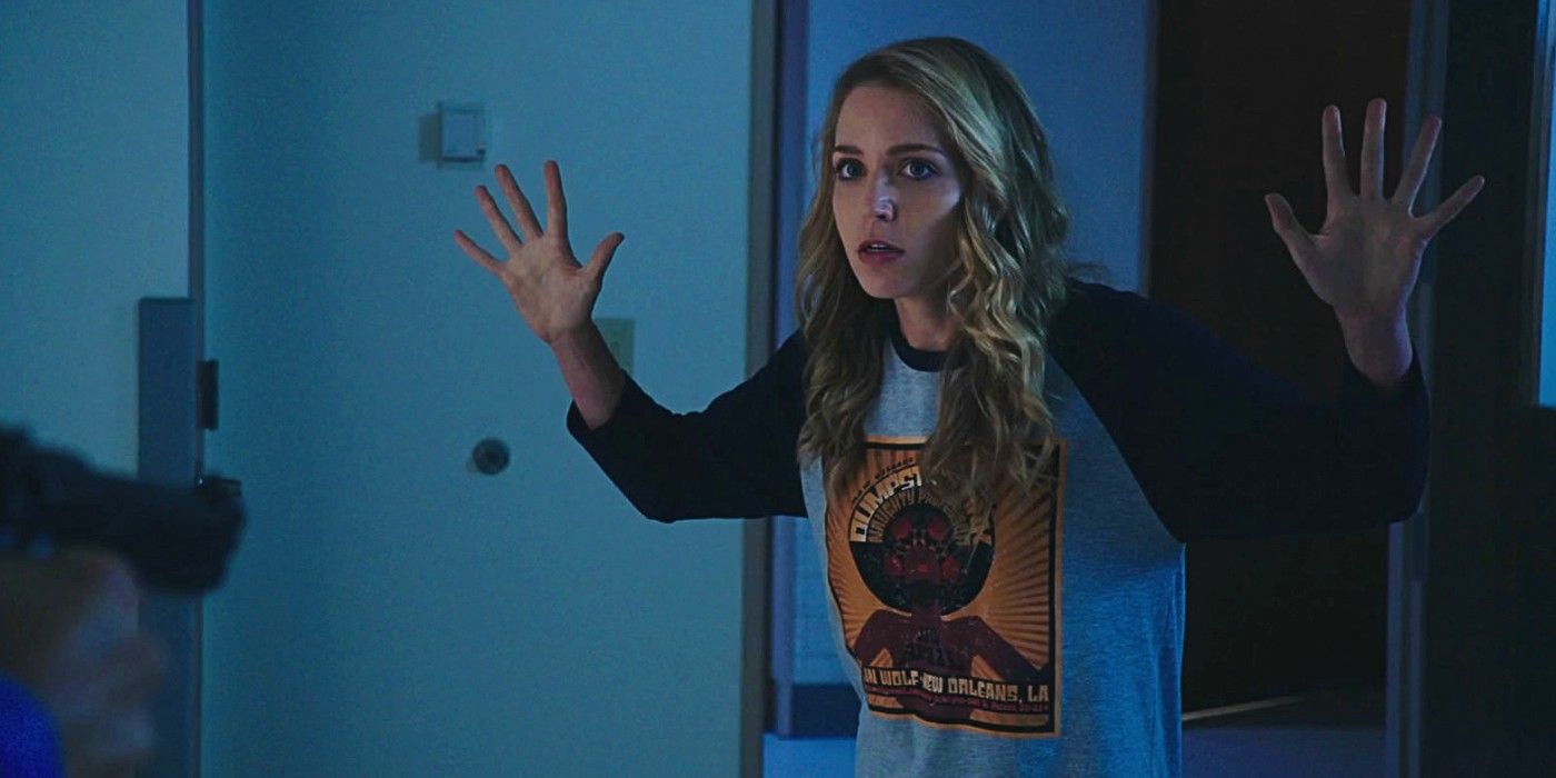 Jessica Rothe putting her hands up in Happy Death Day 2U