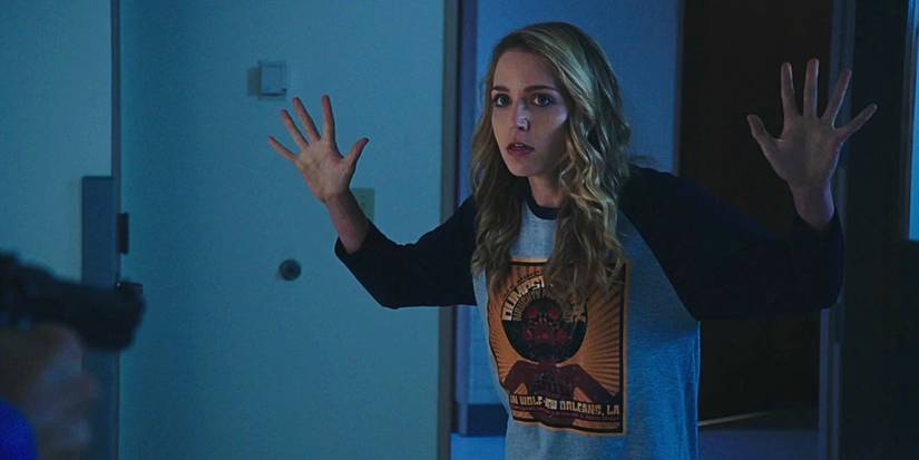 Jessica Rothe putting her hands up in Happy Death Day 2U