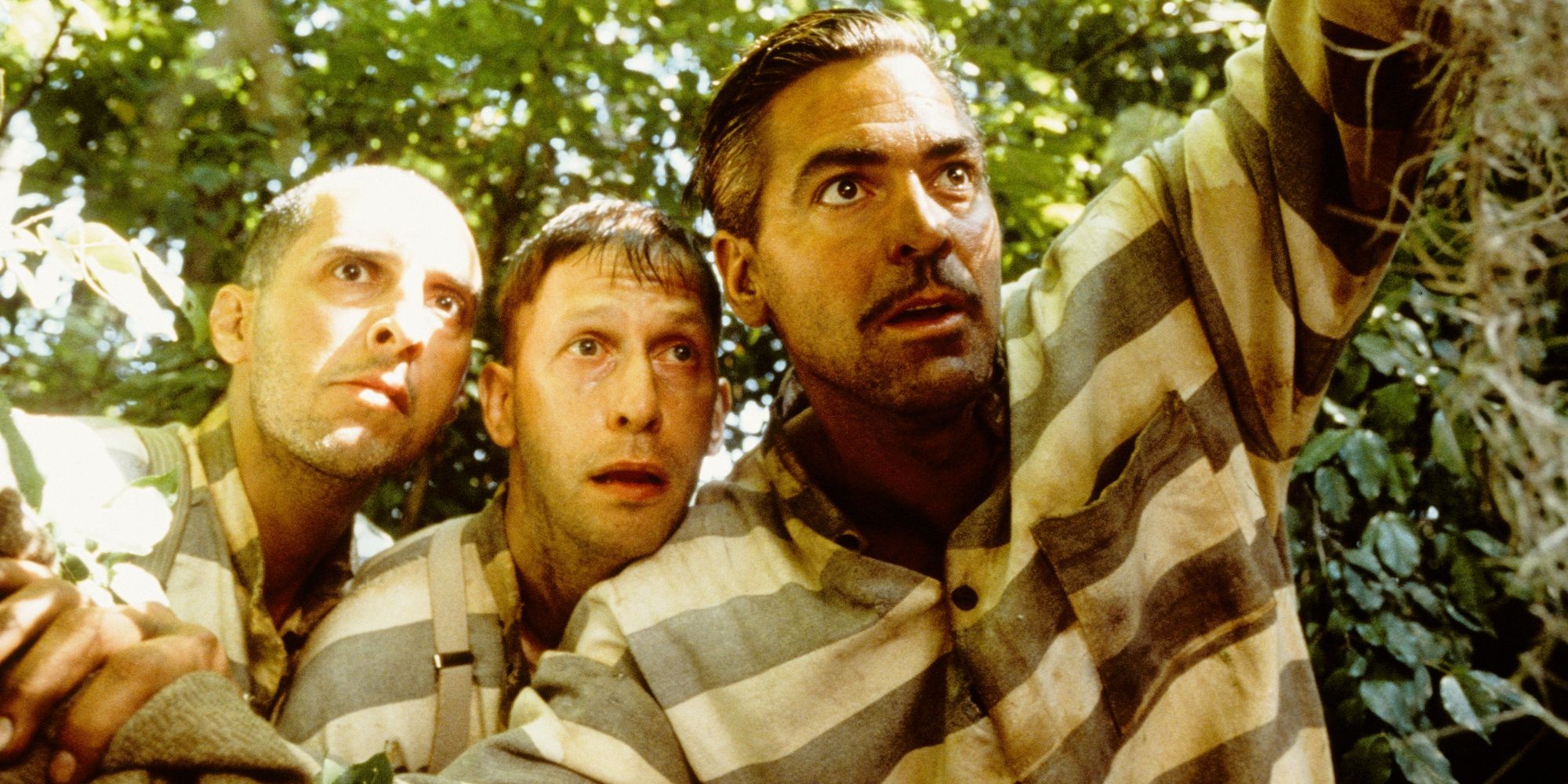 John Turturro, George Clooney, and Tim Blake Nelson in the woods in O Brother, Where Art Thou?