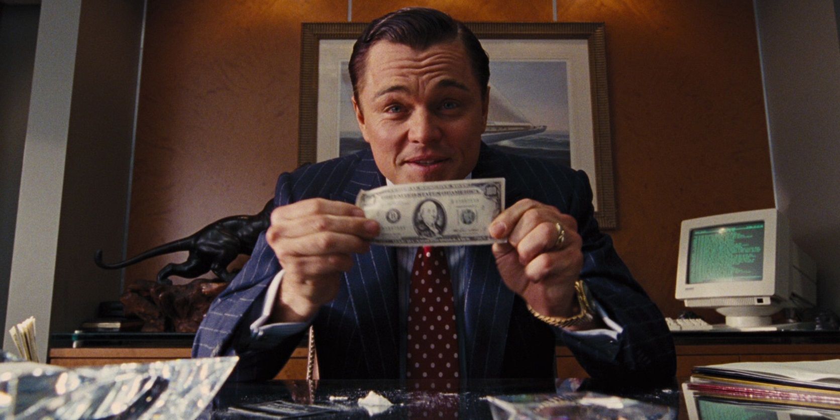 Jordan with a 100 dollar bill in The Wolf of Wall Street