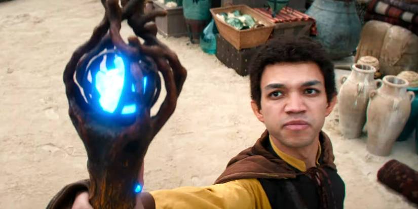 Justice Smith as Simon Aumar with a staff in Dungeons & Dragons: Honor Among Thieves