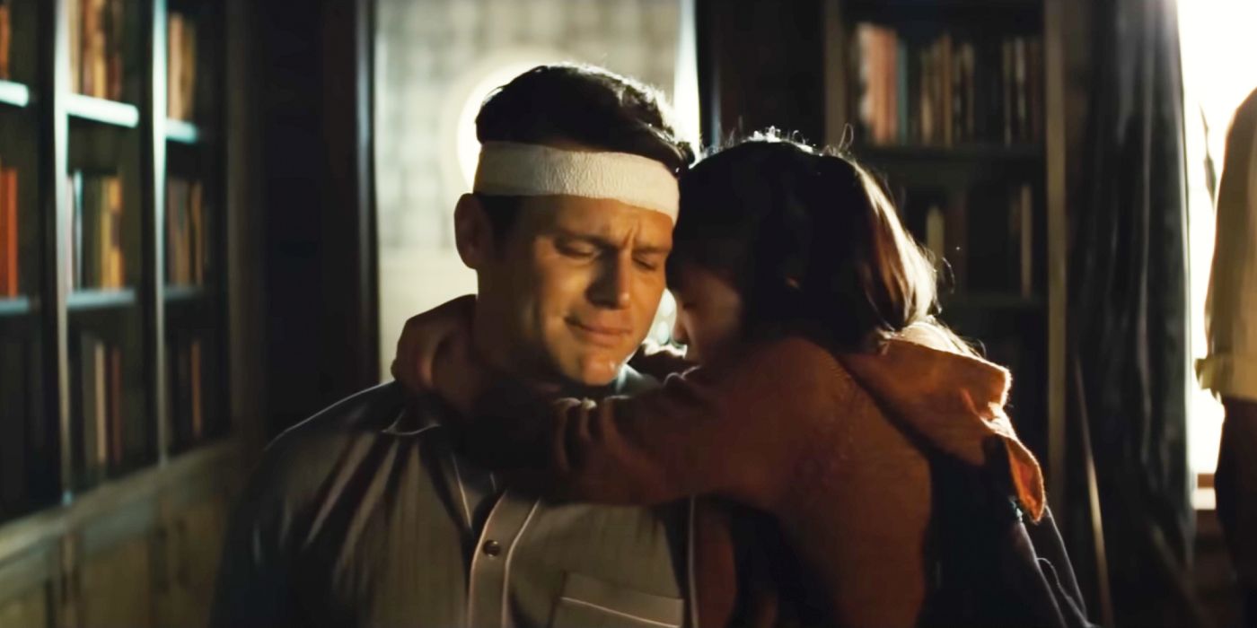 Wen and her father hugging in Knock at the Cabin