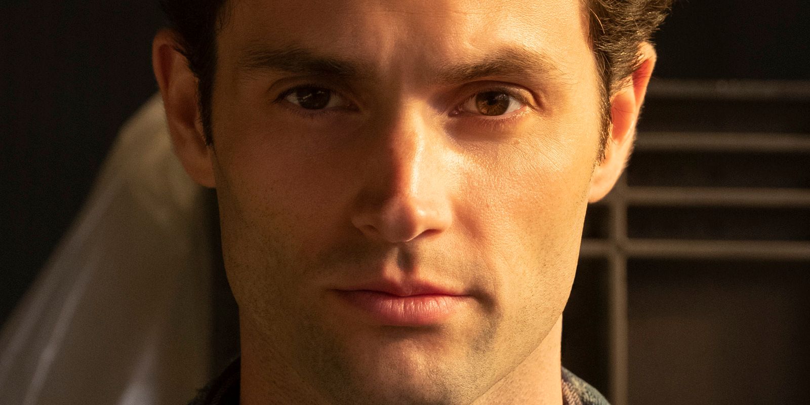 Penn Badgley stares into camera as Joe in Netflix's You