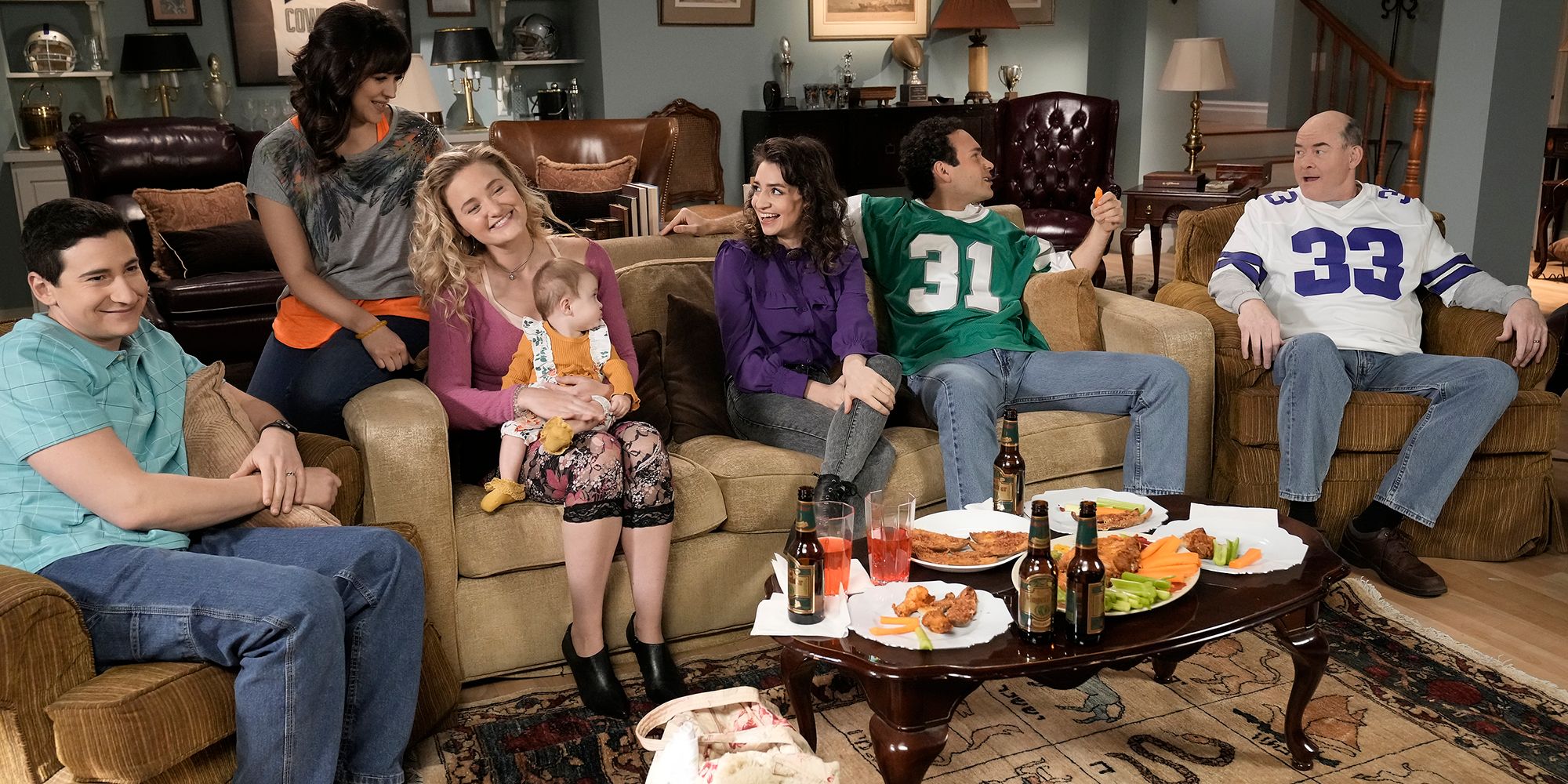The Goldbergs characters sitting on couch in season 10