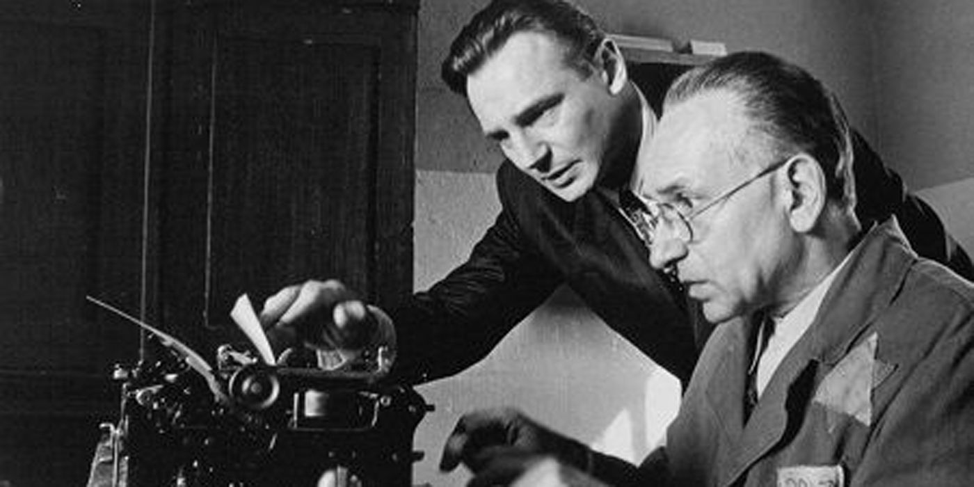 Liam Neeson and Ben Kingsley at a typewriter in Schindler's List.