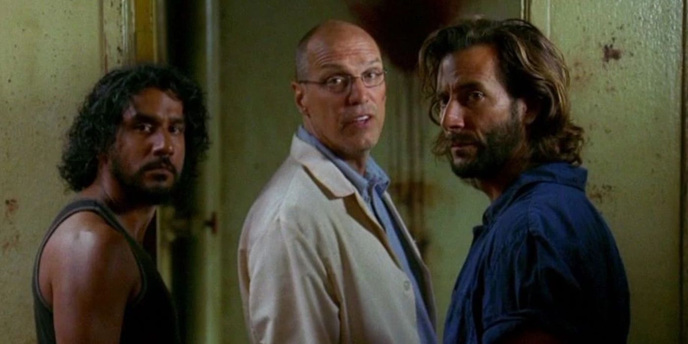 Sayid, Doc Ray, and Desmond look on in Lost