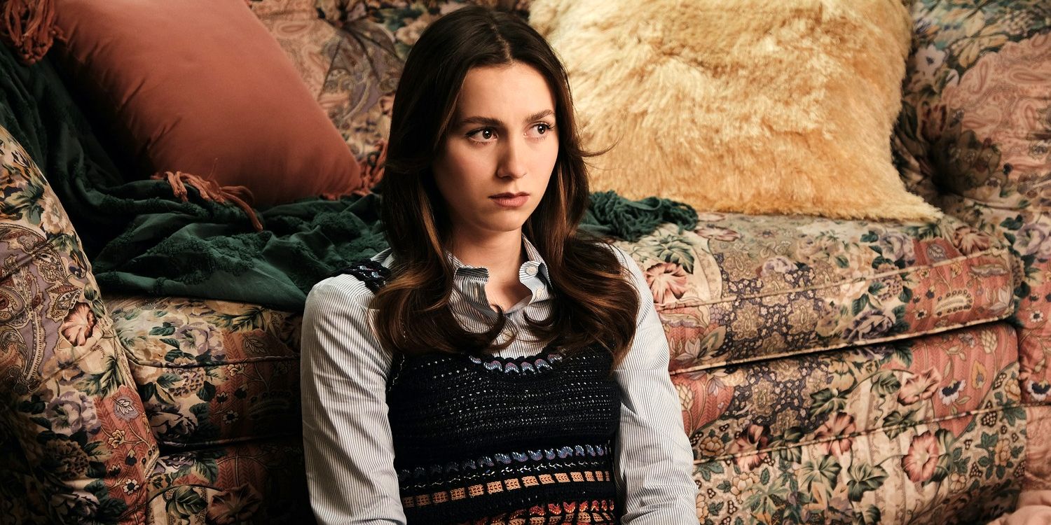 Maud Apatow as Lexi reclining on a couch in Euphoria