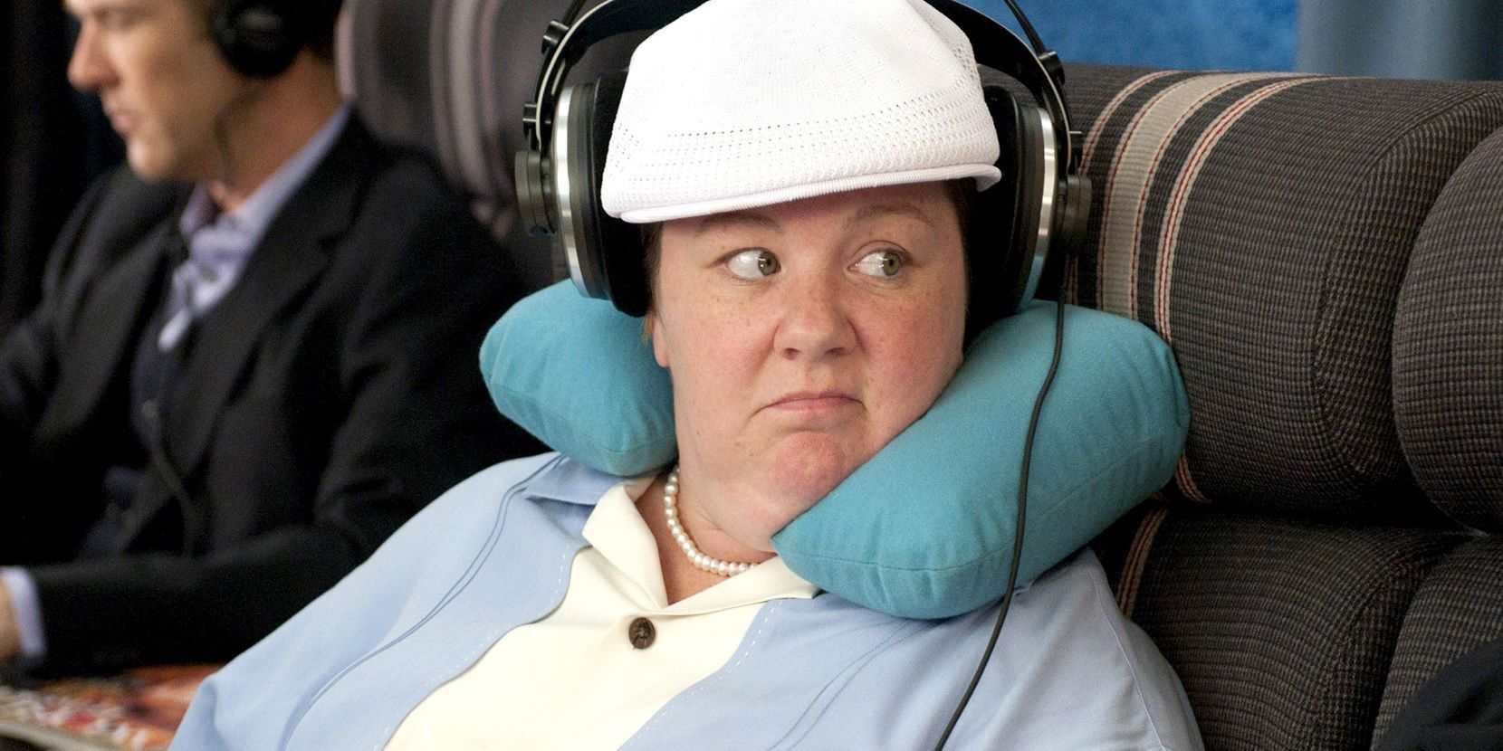 Megan on a plane in Bridesmaids