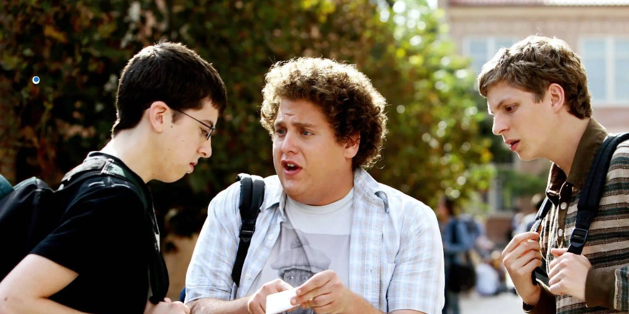 Michael Cera, Jonah Hill, and Christopher Mintz Plasse looking at id in Superbad