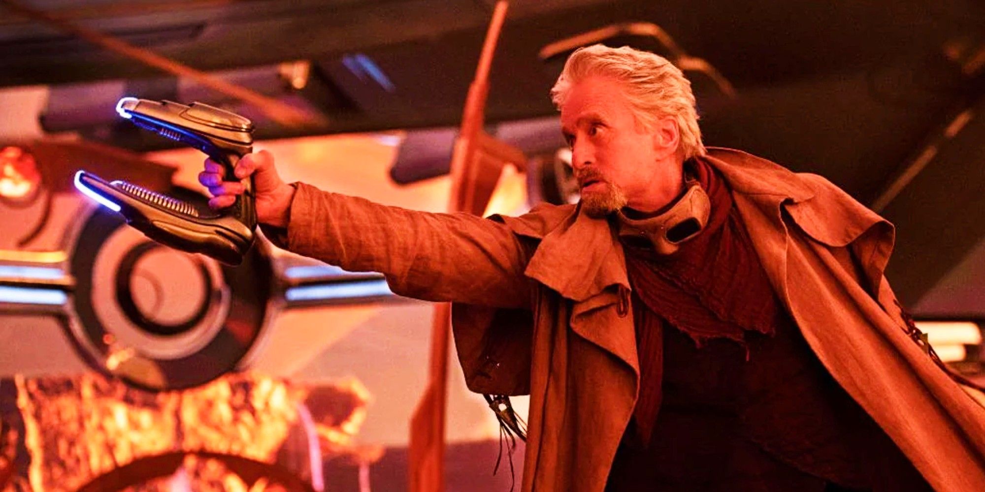 Michael Douglas as Hank Pym holding a blaster in Ant-Man and the Wasp Quantumania