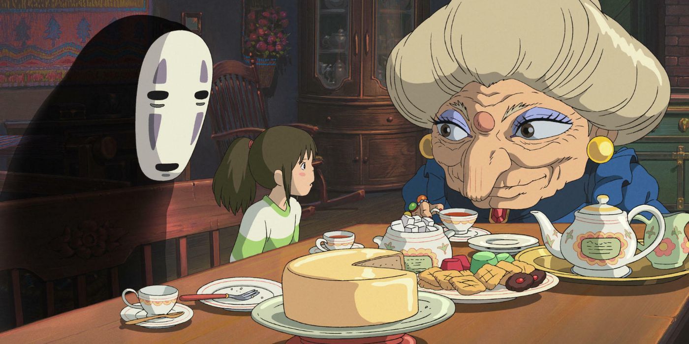 No-Face and Chihiro sitting at a table with Zeniba having tea and snacks in Spirited Away.
