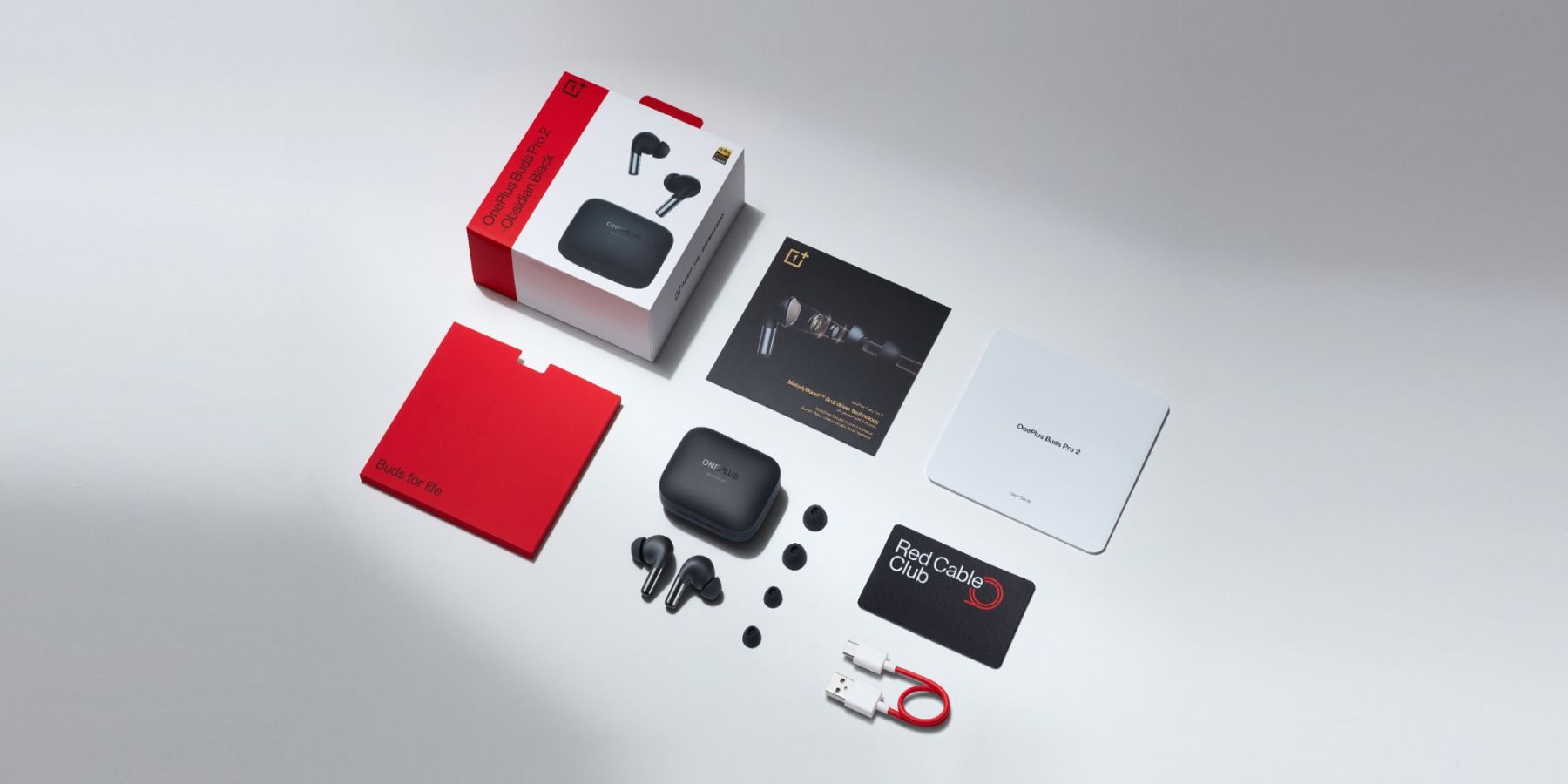 A photo showing the OnePlus Buds Pro 2 and its accessories