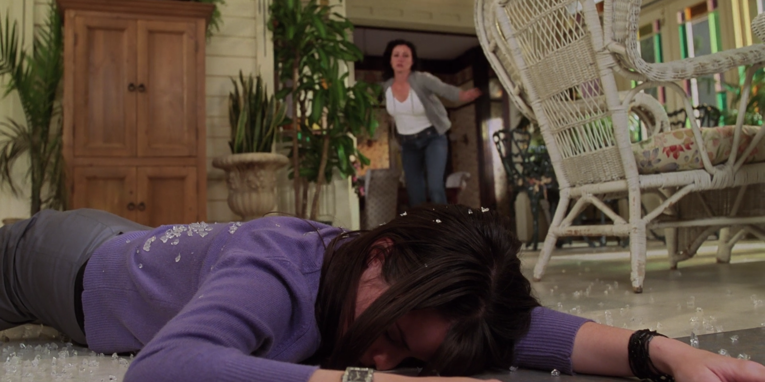 Piper, laying in a pile of broken glass, on Charmed