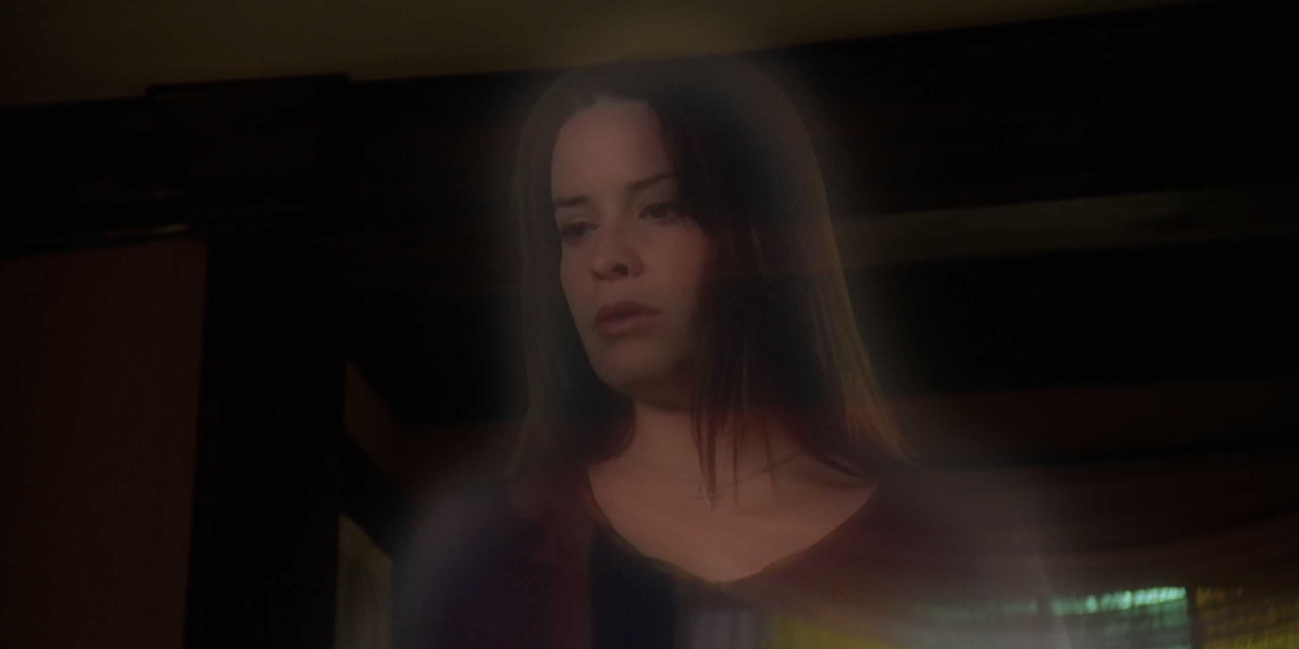 Piper looks down at Charmed's body in concern