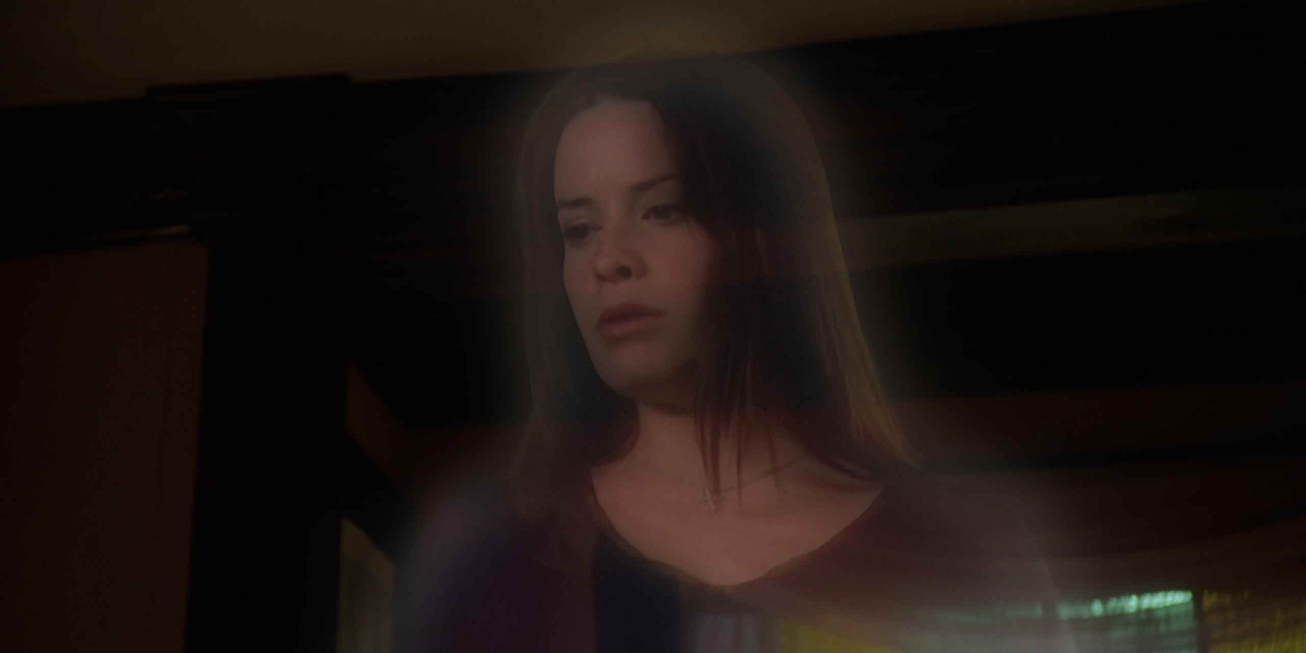 Piper looks down at her body with concern on Charmed