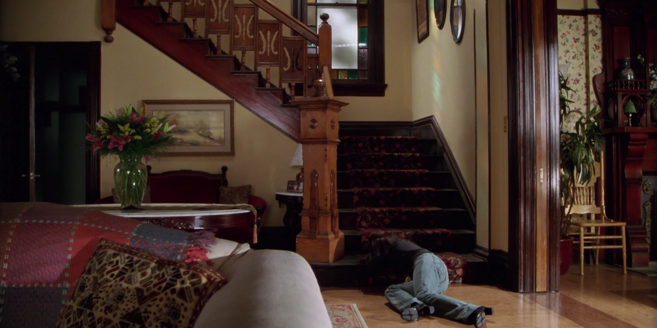 Piper's body sinks to the stairs in Charmed