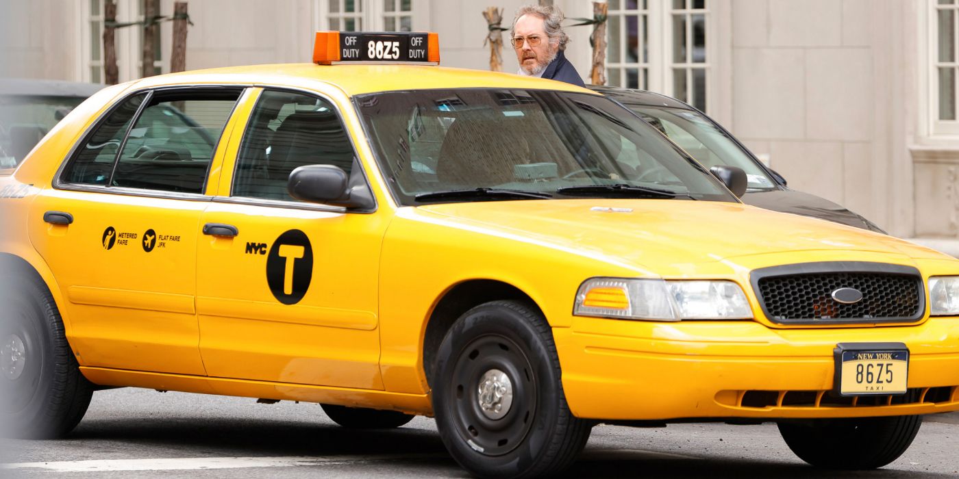 Reddington getting in a taxi with hair and a beard in The Blacklist season 10