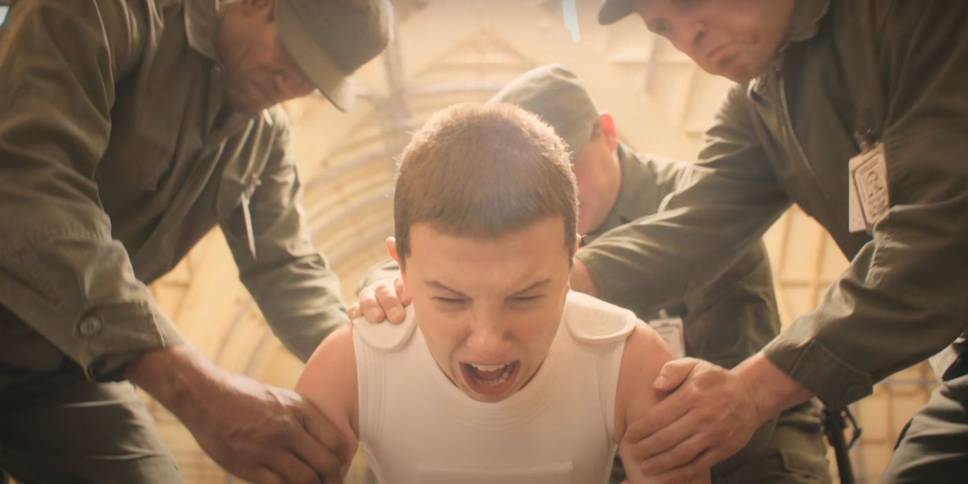 Eleven screaming as she's dragged back by uniformed soldiers in Stranger Things
