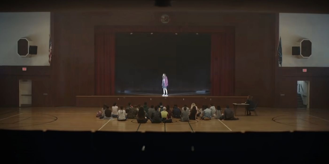 Rue speaking on a stage in Euphoria