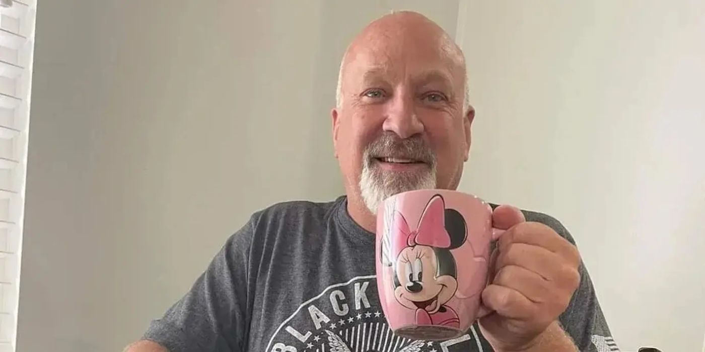 Sister Wives star Christine Brown's boyfriend David Woolley holding a Minnie Mouse mug