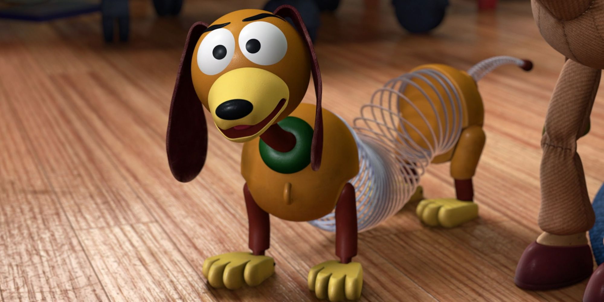 Slinky-Dog standing on a wood floor in the Toy Story franchise