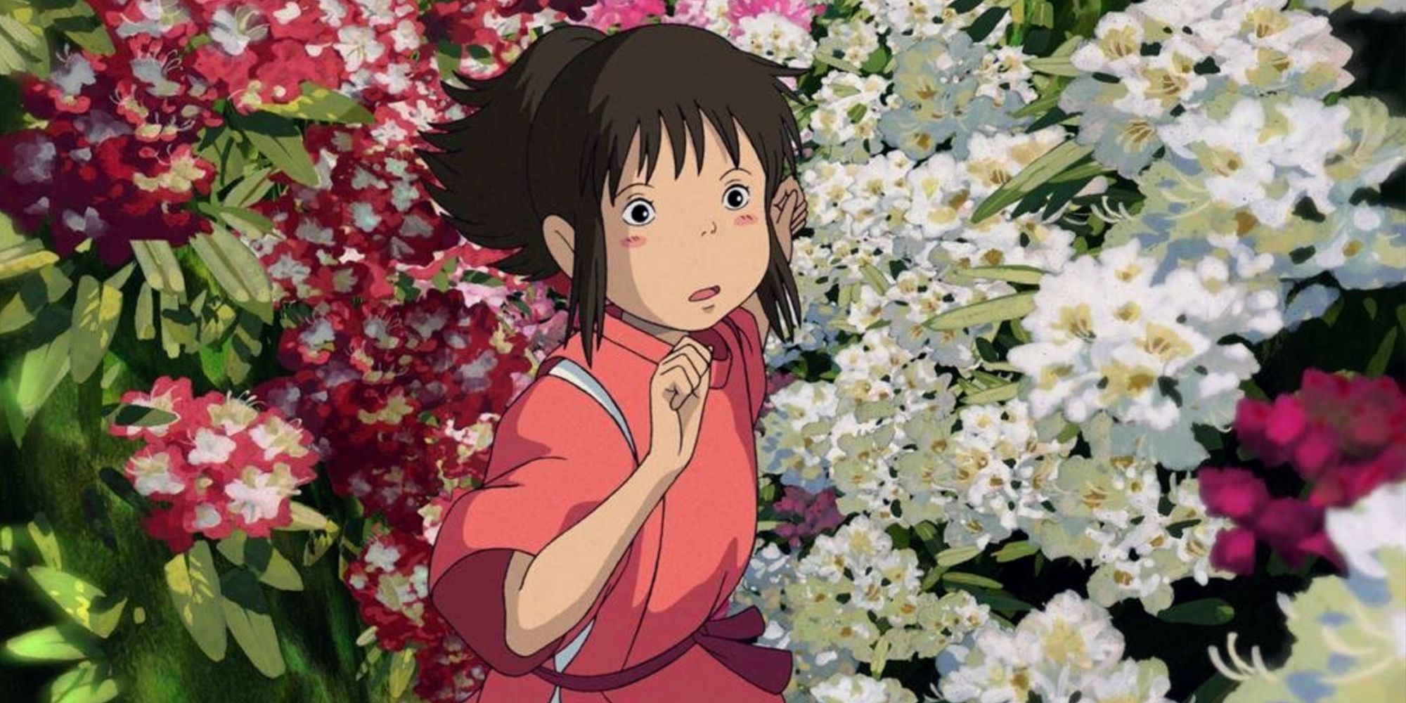 Chihiro runs through flowers in Studio Ghibli's Spirited Away