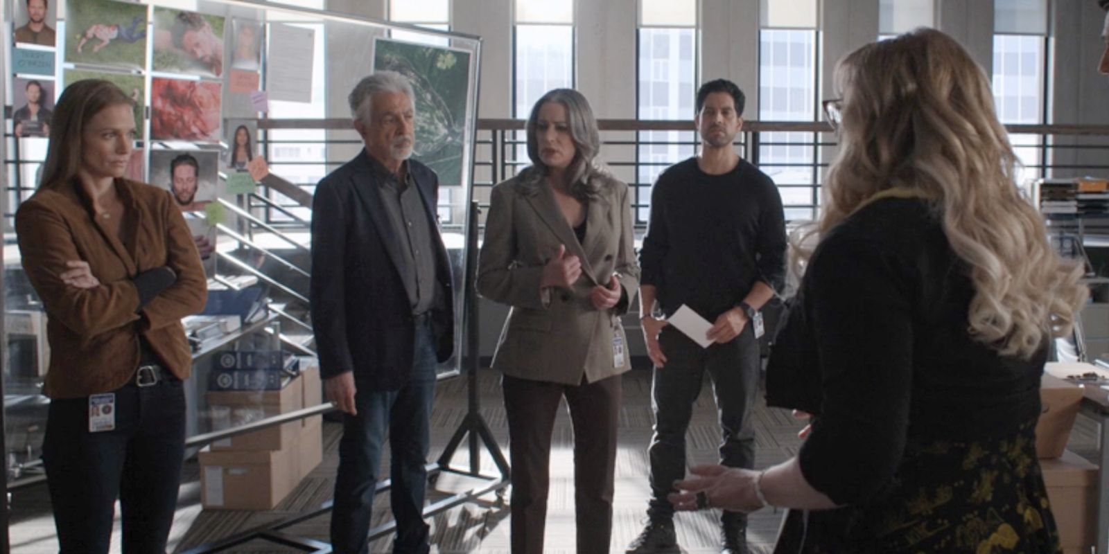 The BAU talking together as a group in their office in Criminal Minds: Evolution