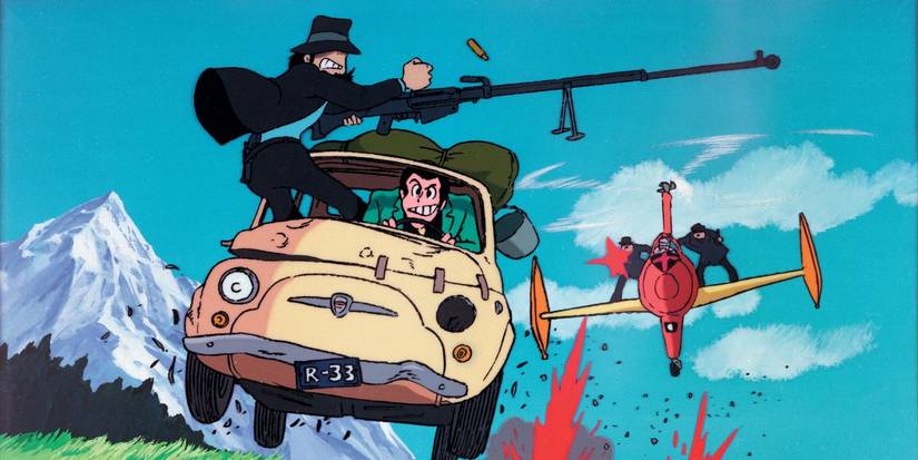 A car with a gun on top drives away from a plane shooting at it. 