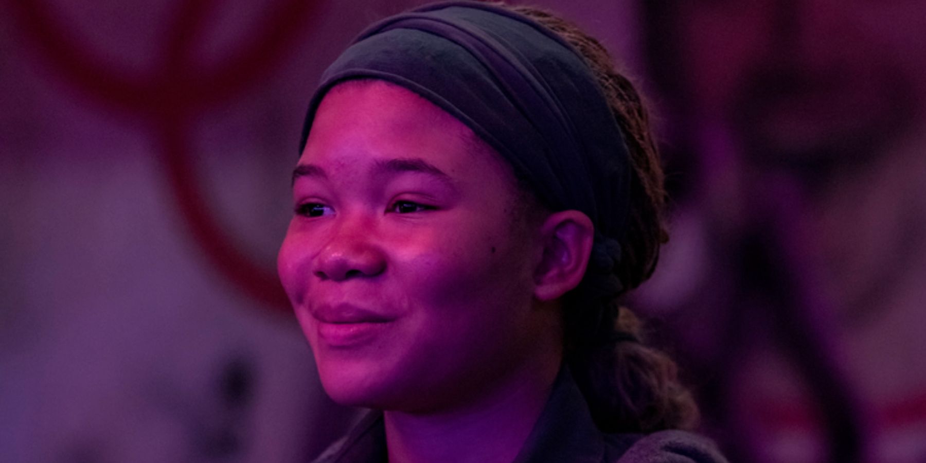 Storm Reid as Riley in purple light in The Last of Us season 1 episode 7