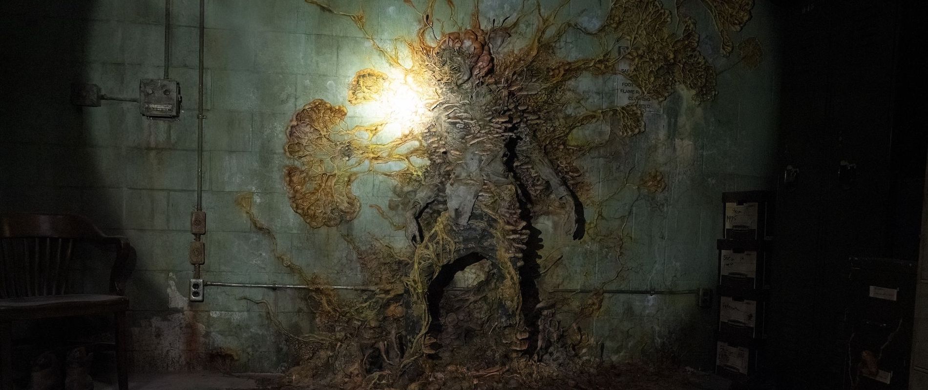 Cordyceps infected zombie from The Last Of Us with fungal outgrowths growing against a way