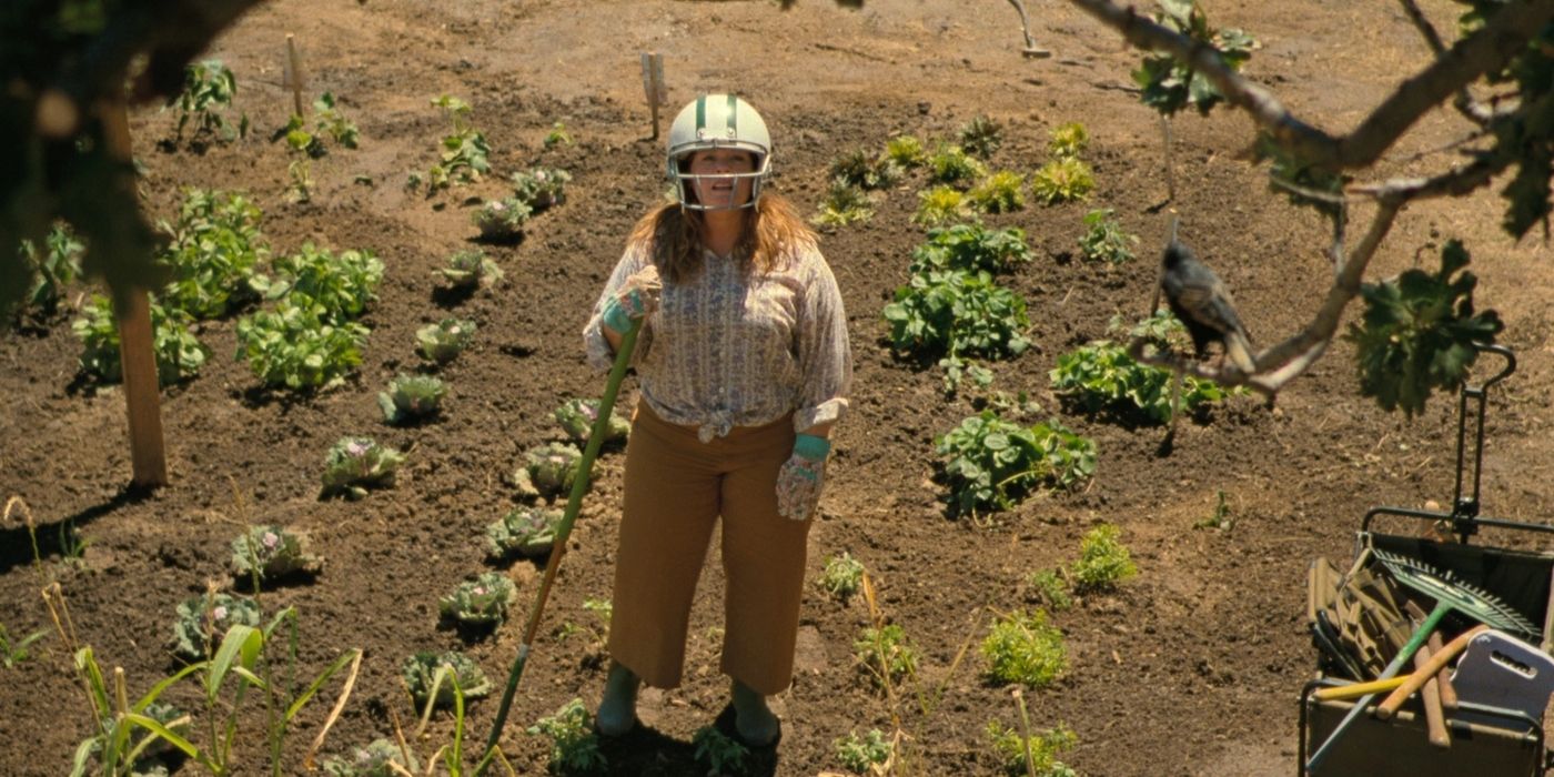 Lilly wearing a helmet standing in a garden in The Starling