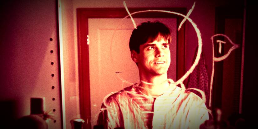 Jim Carrey drawing a space suit in the mirror in The Truman Show